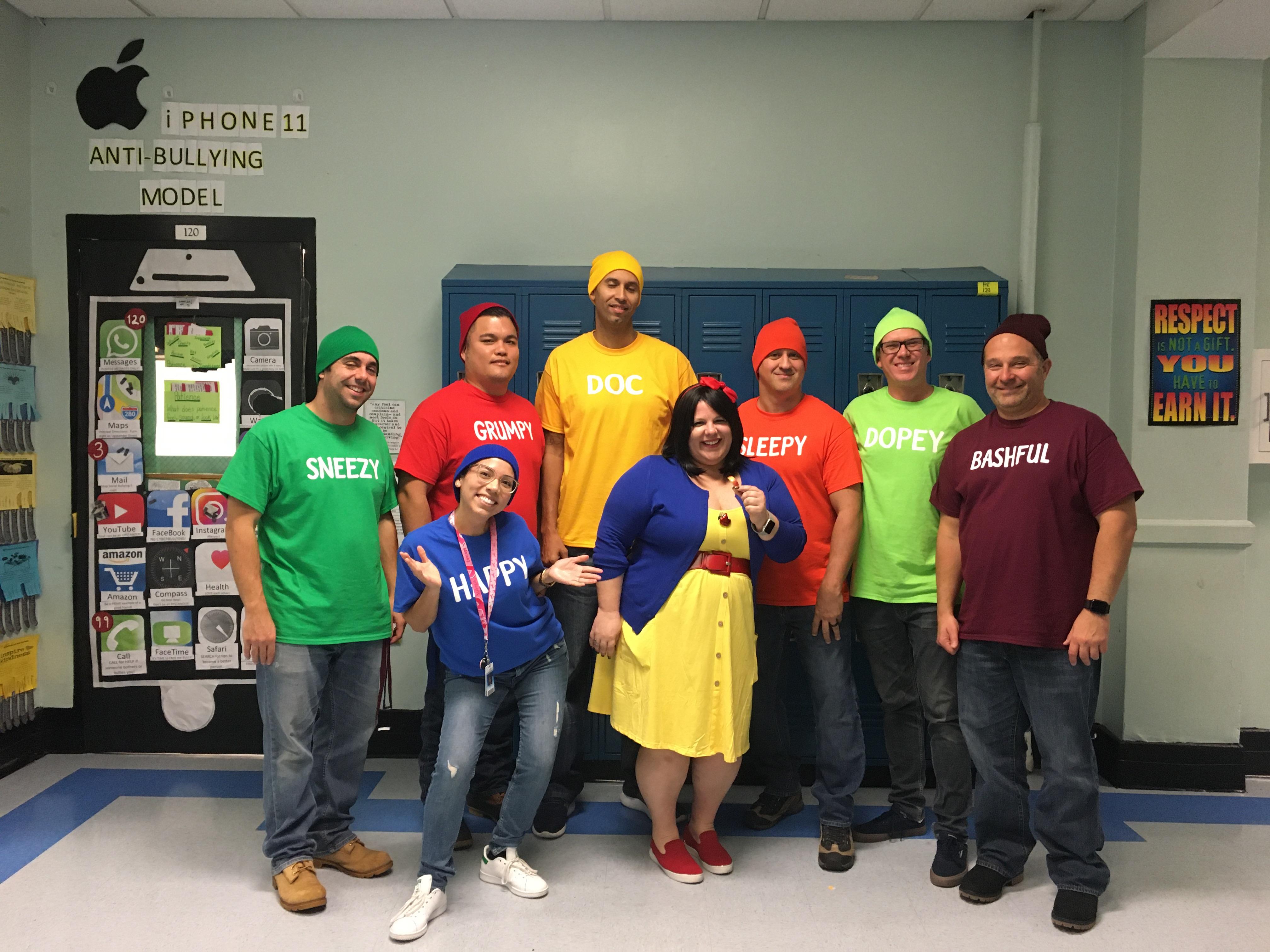 group of teachers dressed as snow white and her dwarfs