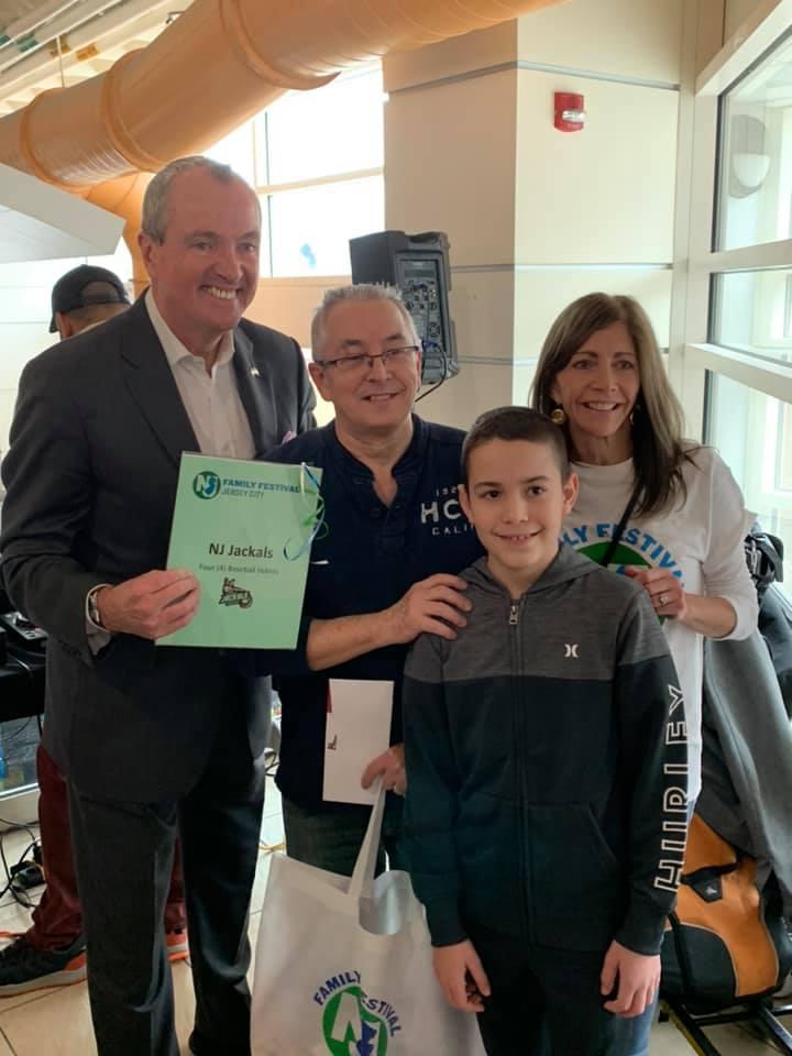 Governor Murphy and his wife with a man and his young son